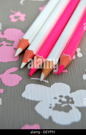 Several pencils on flowery background, creativity Stock Photo