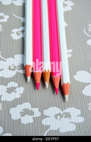 Several pencils on flowery background, creativity Stock Photo