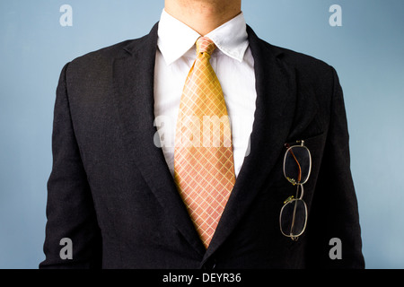 Close up on business man with his glasses in his front pocket Stock Photo