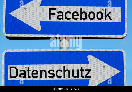 One-way street signs in opposite directions, Facebook and Datenschutz or data protection, symbolic image Stock Photo