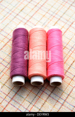 Yarn, cotton reels, spools of thread, pink, purple Stock Photo