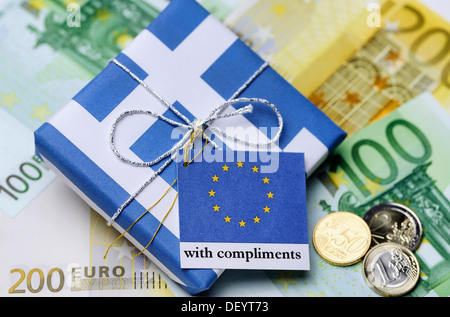 Package wrapped in a Greek flag with a greeting card from the EU, symbolic image of the aid package for Greece Stock Photo