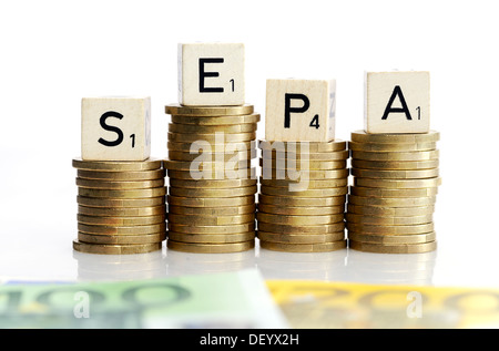 SEPA stroke on monetary coins, SEPA procedures, SEPA-Schriftzug auf Geldmünzen, SEPA-Verfahren Stock Photo