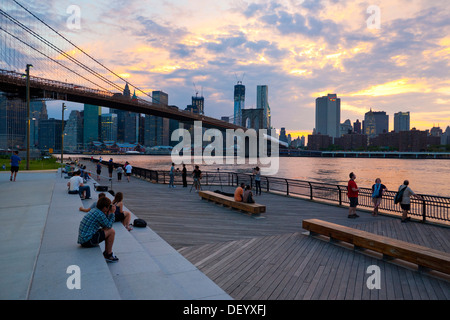 Dumbo neighborhood, Brooklyn, overlooking the East River with the skyline of Manhattan and Brooklyn Bridge, New York City, USA Stock Photo