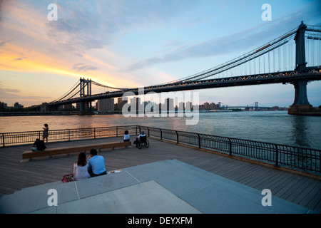 Dumbo neighborhood, Brooklyn, overlooking the East River with the skyline of Manhattan and Brooklyn Bridge, New York City, USA Stock Photo