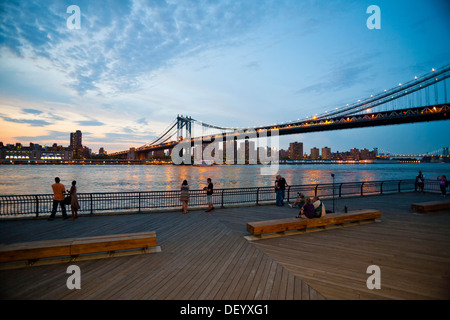 Dumbo neighborhood, Brooklyn, overlooking the East River with the skyline of Manhattan and Manhattan Bridge, New York City, USA Stock Photo