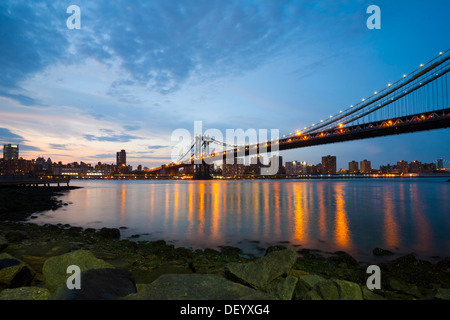 Dumbo neighborhood, Brooklyn, overlooking the East River with the skyline of Manhattan and Manhattan Bridge, New York City, USA Stock Photo