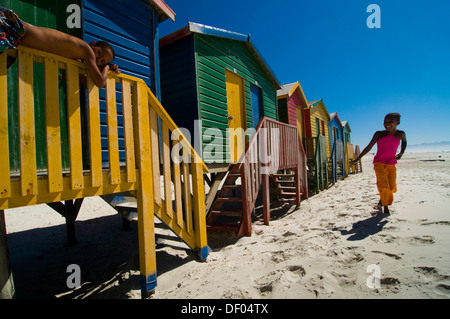 Girl and boy on a beach, colourful beach houses, Muizenberg, Western Cape, South Africa, Africa