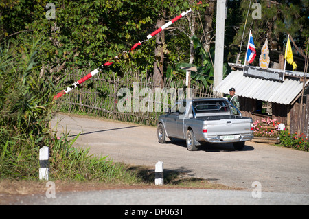 Policeman, police control, SUV or pick-up truck at the police control point in the road, Northern Thailand, Thailand, Asia Stock Photo