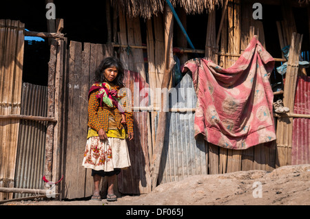 Woman dressed with modern clothing with child from the Mlabri, Mrabri, Yumbri, Ma Ku or 'Spirits of the Yellow Leaves' hill Stock Photo