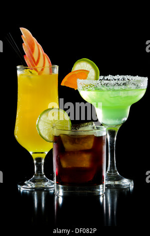 three colorful refreshing cocktails served on a black background Stock Photo