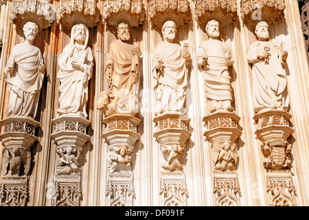Figures of the apostles on the Gothic portal, main entrance, Dominican convent Mosteiro de Santa Maria da Vitoria Stock Photo