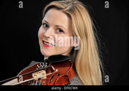 Young woman playing the violin, Schwäbisch Gmünd, Ostalbkreis, Baden-Württemberg, Germany Stock Photo