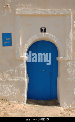 Typically shaped blue door on a white facade in Sidi Ifni, Morocco, Africa Stock Photo