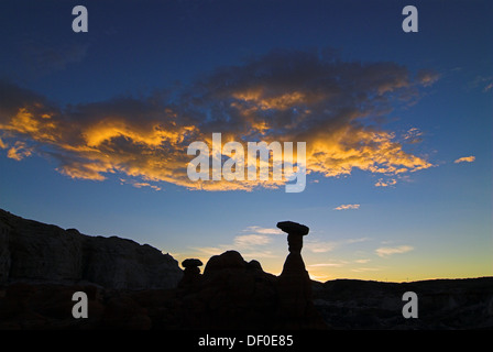 Silhouettes of the hoodoos, rock formations, of the Rimrocks area, Toadstool Valley, at sunrise, in southern Utah, USA Stock Photo