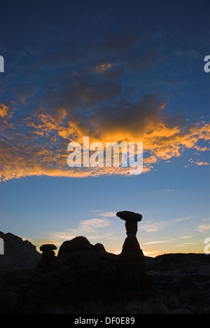 Silhouettes of the hoodoos, rock formations, of the Rimrocks area, Toadstool Valley, at sunrise, in southern Utah, USA Stock Photo