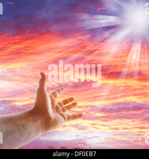 Hand reaching for the sky Stock Photo