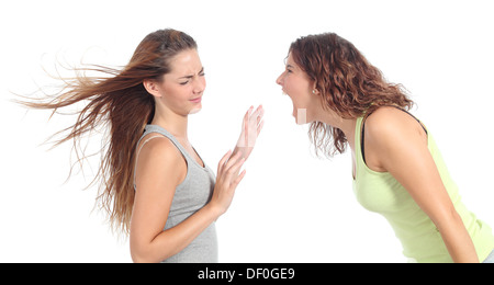 Woman shouting angry to another one isolated on a white background Stock Photo