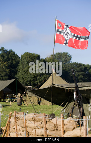 Military vehicles and re-enactors in Battle at the Victory Show at Cosby German Encampment with sand bags and Barbed Wire Stock Photo