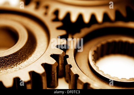 Closeup of three metal cog gears Stock Photo