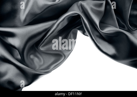 Closeup of rippled black silk fabric on plain background Stock Photo