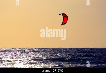 Kite surfing at sunset on Nai Yang Beach, Phuket Island, Thailand Stock Photo