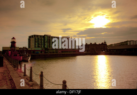 City Quay Dundee sunset over dock with lightship and hotel Stock Photo