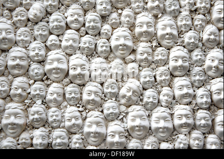 Many heads of plaster on a door, DOOR LOCK, decoration in Funchal, Madeira Stock Photo