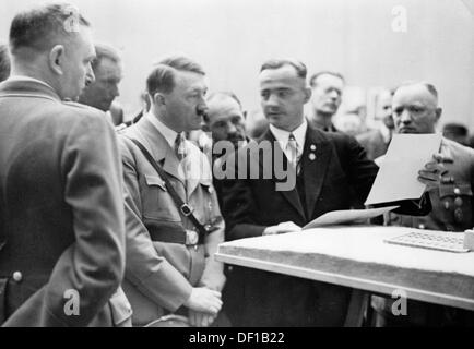 The image from the Nazi Propaganda! shows Adolf Hitler in the exhibition of the German War Graves Commission in the city hall of Dresden, Germany, during the Reichstheaterfestwoche (Reich Theatre Festival) in 1934. Fotoarchiv für Zeitgeschichte Stock Photo