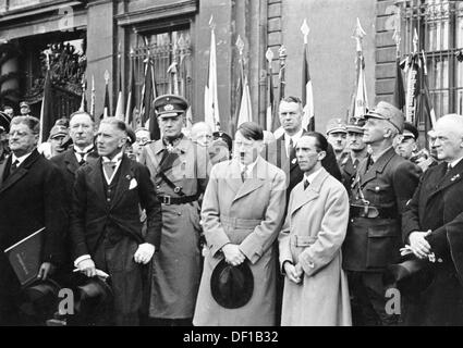 The image from the Nazi Propaganda! shows Adolf Hitler with Vice Chancellor Franz von Papen (2-l), Reich Minister of Defense Werner von Blomberg (3-l) and Reich Propaganda Minister Joseph Goebbels in the Lustgarten in Berlin, Germany, on the occasion of the celebrations of May 1 1933. Fotoarchiv für Zeitgeschichte Stock Photo