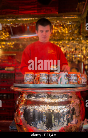 Man making gluhwein at Christmas Market, Nuremberg, Germany Stock Photo