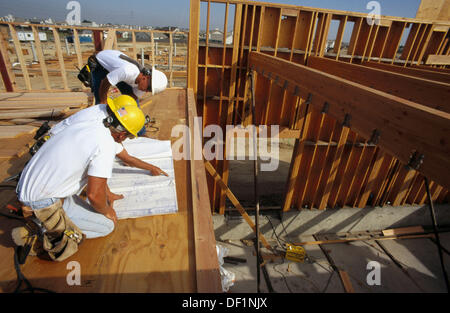 Jobsite foreman giving instructions to carpenters on school Stock Photo ...