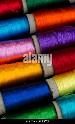 Colourful spools of Indian silk embroidery thread. India Stock Photo