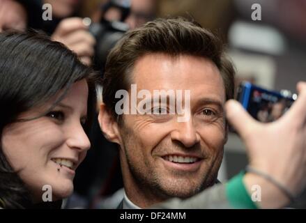 Berlin, Germany. 26th Sep, 2013. Australian actor Hugh Jackman poses with a fan on arrival to the Germany premiere of his new film 'Prisoners' in Berlin, Germany, 26 September 2013. The thriller will start in Germany cinemas from 10 October 2013. Photo: Soeren Stache/dpa/Alamy Live News Stock Photo