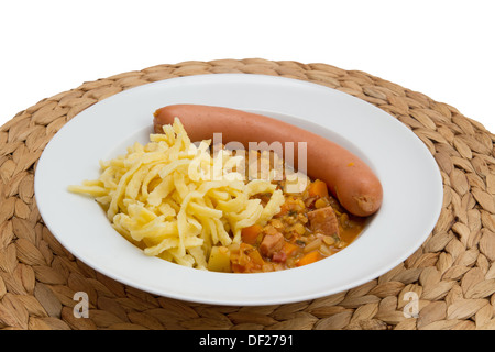 Lentils with spaetzle (noodles) and frankfurter sausage Stock Photo