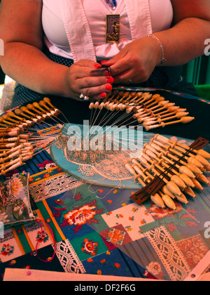 Woman hands making Bruges traditional bobbin lace Stock Photo