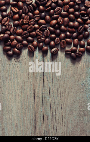 Coffee beans closeup on wooden background Stock Photo