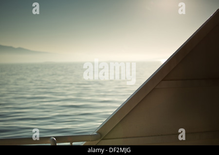 Blue water and sky with heavy clouds Stock Photo