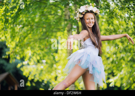 Fine photo of young nymph wearing flowers Stock Photo