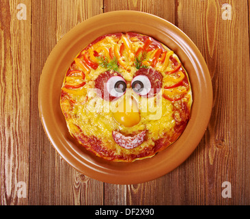 Smiley Faced Pizza.Baby menu Stock Photo