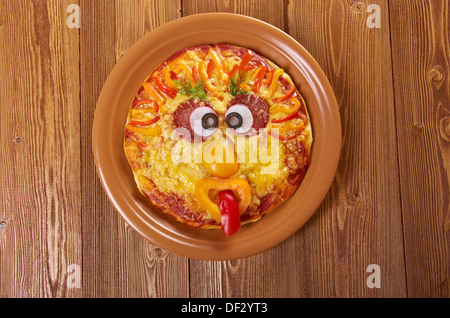 Smiley Faced Pizza.Baby menu Stock Photo