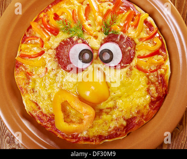 Smiley Faced Pizza.Baby menu Stock Photo