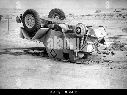The image from the Nazi Propaganda! depicts a destroyed British armored car in Africa, published on 13 February 1942. Place unknown. Fotoarchiv für Zeitgeschichte Stock Photo