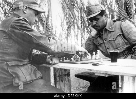 The image from the Nazi Propaganda! depicts soldiers playing chess in Africa. Place and date unknown. Fotoarchiv für Zeitgeschichte Stock Photo