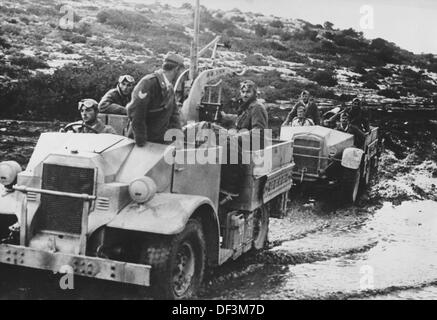 The image from the Nazi Propaganda! depicts soldiers of the Italian artillery driving through Cyrenaica in Libya, published 29 January 1941. Place unknown. Fotoarchiv für Zeitgeschichte Stock Photo