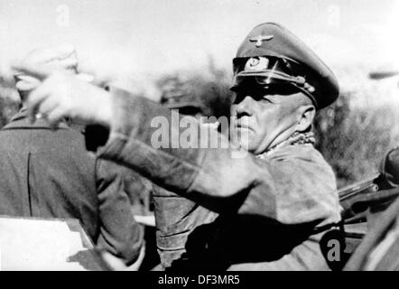 Field Marshal Erwin Rommel is pictured outside during the occupation of Tobruk, Libya, in May 1942. The Nazi Propaganda! on the back of the iamge is dated 30 May 1942: 'From the front in North Africa. General Rommel visits a base on the frontline.' Fotoarchiv für Zeitgeschichte Stock Photo