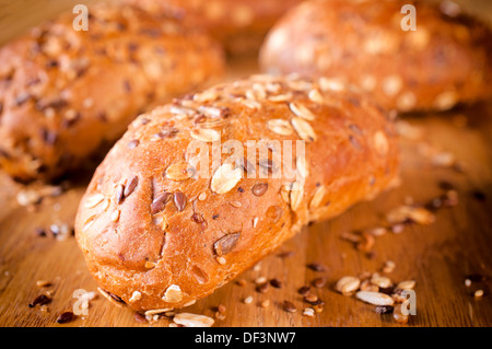 Small whole grain breads. Selective focus on the front bread Stock Photo