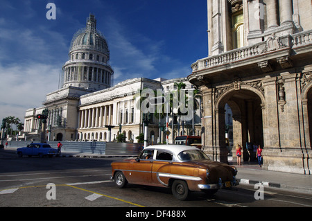 Old car passing in front of El Capitolio - Havana, Cuba Stock Photo