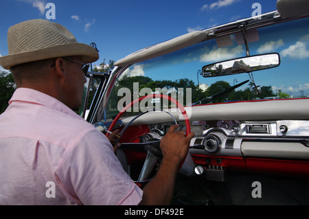 Driving around in a vintage convertible - Havana, Cuba Stock Photo