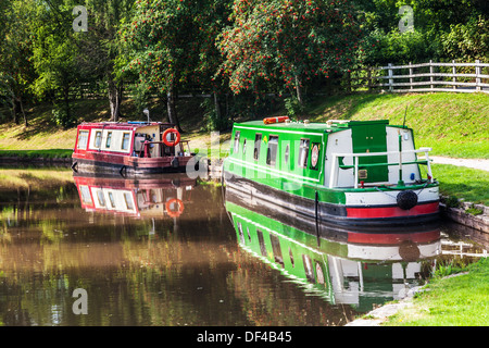 Narrowboats moored along the Monmouthshire and Brecon Canal at Llangynidr lock in the Brecon Beacons National Park. Stock Photo